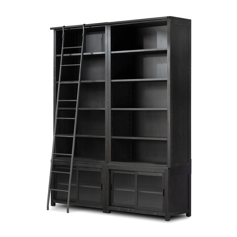 Admont double library bookcase in worn black oak with a sliding ladder and gunmetal rail.