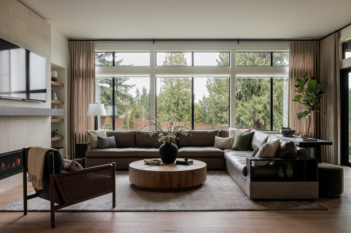 Living room with sofa and chairs, designed by Elegant Simplicity Interiors for Mimi + Brooks.